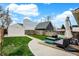 Private backyard featuring a patio, seating area, and well-maintained lawn at 305 Sanders St, Indianapolis, IN 46225