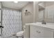Updated bathroom with a modern vanity, geometric shower curtain, and neutral paint at 305 Sanders St, Indianapolis, IN 46225