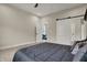 An airy bedroom featuring a platform bed, barn door, and open doorway, allowing views to other rooms at 305 Sanders St, Indianapolis, IN 46225