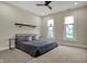 A cozy bedroom with a platform bed, floating shelf, and bright windows, providing comfort and style at 305 Sanders St, Indianapolis, IN 46225