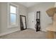 The bedroom offers space for exercise equipment, a closet, and natural light from the window at 305 Sanders St, Indianapolis, IN 46225