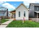 A cozy home featuring a lush lawn and a charming picket fence for added curb appeal at 305 Sanders St, Indianapolis, IN 46225