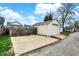 Detached garage featuring a parking pad and a quaint single-car garage at 305 Sanders St, Indianapolis, IN 46225