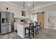 Modern kitchen featuring stainless steel appliances, a central island, and unique barn door accent at 305 Sanders St, Indianapolis, IN 46225