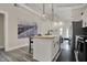 The kitchen includes a kitchen island, stainless steel appliances, and modern countertops at 305 Sanders St, Indianapolis, IN 46225