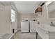 Well-lit laundry room with a utility sink, and washer and dryer hookups at 305 Sanders St, Indianapolis, IN 46225