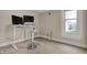 Bright office area with a computer desk setup and natural light from the window at 305 Sanders St, Indianapolis, IN 46225
