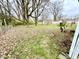 Backyard featuring a mix of grass and leaves at 3536 N Hawthorne Ln, Indianapolis, IN 46218