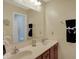 A bathroom with double vanity, granite countertops, and black towels at 36 Palomino Ct, Zionsville, IN 46077