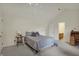 A bedroom featuring vaulted ceilings and neutral colors at 36 Palomino Ct, Zionsville, IN 46077