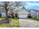 Charming single-Gathering home with a well-manicured lawn and attached two-car garage at 36 Palomino Ct, Zionsville, IN 46077