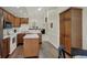 Well-lit kitchen featuring white countertops, oak cabinets, and an island with seating at 36 Palomino Ct, Zionsville, IN 46077