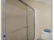 A shower with a sliding glass door and tile flooring at 36 Palomino Ct, Zionsville, IN 46077