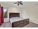 Relaxing bedroom featuring a large window, ceiling fan and a spacious closet at 3748 Pawnee Trl, Columbus, IN 47203
