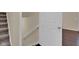 Hallway featuring carpet stairs and a white door leading to the next room at 3748 Pawnee Trl, Columbus, IN 47203