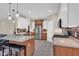 Bright kitchen featuring stainless steel appliances, granite countertops, and center island with breakfast bar at 3748 Pawnee Trl, Columbus, IN 47203