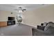 Comfortable living area with ceiling fan, window, hanging chair, and cozy furnishings at 3748 Pawnee Trl, Columbus, IN 47203