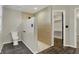 Modern bathroom features a tile shower, toilet, and an entrance to a spacious walk-in closet at 3771 Lakewood Dr, Greenfield, IN 46140