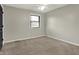 Bedroom has neutral carpet, light-colored walls, ceiling fan, and window with blinds at 3771 Lakewood Dr, Greenfield, IN 46140