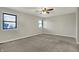 A cozy bedroom with neutral paint and carpet and abundant natural light at 3771 Lakewood Dr, Greenfield, IN 46140