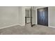 Bedroom features neutral carpet, light-colored walls, and an open closet at 3771 Lakewood Dr, Greenfield, IN 46140