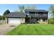 Charming two-story home with a well-manicured lawn and a two car garage at 3771 Lakewood Dr, Greenfield, IN 46140