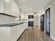 Bright kitchen features modern appliances, sleek countertops, white subway tile backsplash, and ample cabinet space at 3771 Lakewood Dr, Greenfield, IN 46140