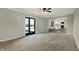 Bright living room features sliding doors to the patio and open flow to the updated kitchen at 3771 Lakewood Dr, Greenfield, IN 46140