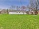Well-maintained backyard featuring a large lawn and privacy fence at 3913 Eastern Dr, Anderson, IN 46012