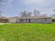 Charming single-story home with well-manicured front lawn and attached garage at 3913 Eastern Dr, Anderson, IN 46012