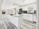Open-concept kitchen with granite counters, stainless appliances, and seamless flow into the cozy living area at 3913 Eastern Dr, Anderson, IN 46012