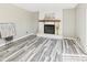 Cozy living room with a white brick fireplace, offering a warm and inviting atmosphere for relaxation and entertainment at 3913 Eastern Dr, Anderson, IN 46012