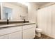 Bathroom showcasing a dual sink vanity with dark countertops and a walk-in shower at 4068 Bozeman Way, Bargersville, IN 46106