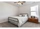 Bright bedroom with a ceiling fan, neutral carpet, and a window with sheer white curtains at 4068 Bozeman Way, Bargersville, IN 46106