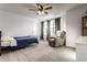 Bedroom featuring neutral walls and carpets, a ceiling fan, a bed, and a chair at 4068 Bozeman Way, Bargersville, IN 46106