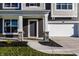 Inviting front entrance with stone pillars, a gray front door, and a well-maintained walkway at 4068 Bozeman Way, Bargersville, IN 46106