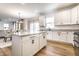 Kitchen with an island and stainless appliances that opens to a dining area at 4068 Bozeman Way, Bargersville, IN 46106