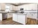Modern kitchen featuring white cabinetry, stainless steel appliances, and a functional center island at 4068 Bozeman Way, Bargersville, IN 46106
