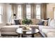 Elegant living room with a plush sectional sofa, stylish decor, and a cozy atmosphere at 4068 Bozeman Way, Bargersville, IN 46106