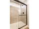 Walk-in shower with glass door and neutral tile at 4068 Bozeman Way, Bargersville, IN 46106