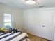 Neat bedroom boasts natural light and sleek wooden floors, perfect for rest and relaxation at 414 Glendale Dr, Columbus, IN 47201