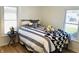 Bright bedroom features comfortable bed, side table and large windows offering natural light at 414 Glendale Dr, Columbus, IN 47201