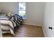 Bright bedroom features comfortable bed and large windows offering natural light at 414 Glendale Dr, Columbus, IN 47201