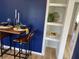 Cozy dining area includes a small dining table with seating and built in shelving at 414 Glendale Dr, Columbus, IN 47201