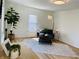 Inviting living space with trendy decor, wood floors, and plenty of natural light at 414 Glendale Dr, Columbus, IN 47201