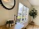 Bright and airy living room featuring a large window, trendy decor, and wood flooring at 414 Glendale Dr, Columbus, IN 47201