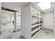 Basement storage features open shelving along a painted brick foundation at 434 E New York St, Indianapolis, IN 46202