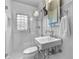 Modern bathroom features subway tile shower, glass partition, stylish mirror, and chrome fixtures at 434 E New York St, Indianapolis, IN 46202