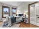 Inviting bedroom with hardwood floors, two large windows and ensuite bathroom at 434 E New York St, Indianapolis, IN 46202
