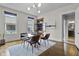 Bright dining room with modern light fixture and view of the neighborhood at 434 E New York St, Indianapolis, IN 46202